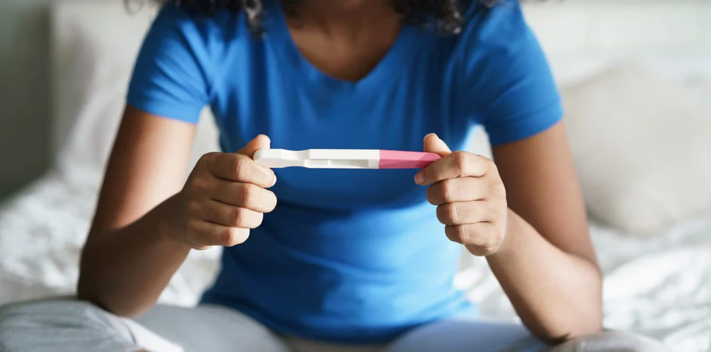 Canva-Sad-Young-Woman-with-Pregnancy-Test_1024x1024