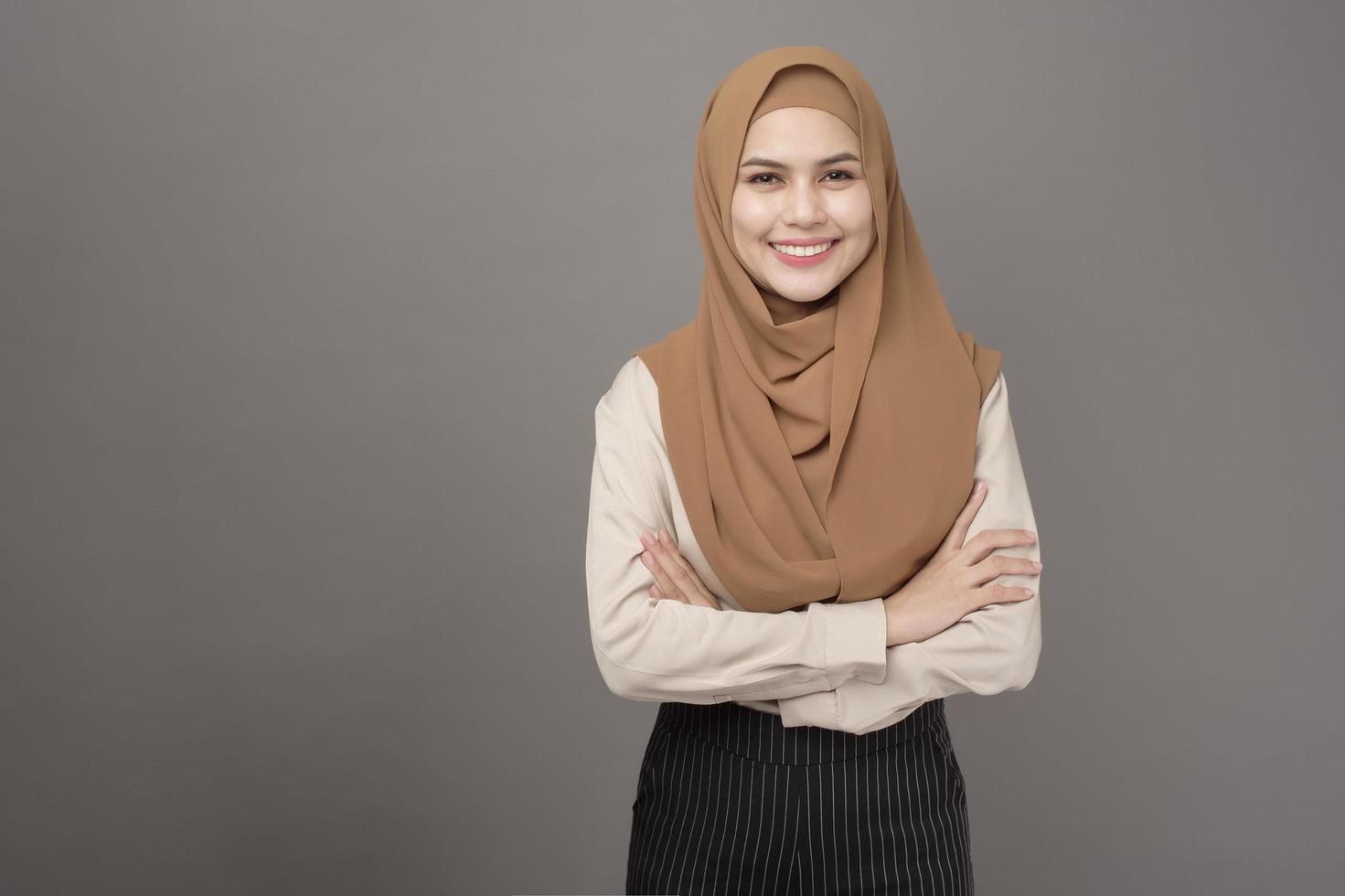 portrait-of-beautiful-woman-with-hijab-is-smiling-on-gray-background-free-photo